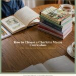 Charlotte Mason curriculum living books stacked on table with tea, blog title overlay: How to Choose a Charlotte Mason Curriculum, What I Learned from A Delectable Education